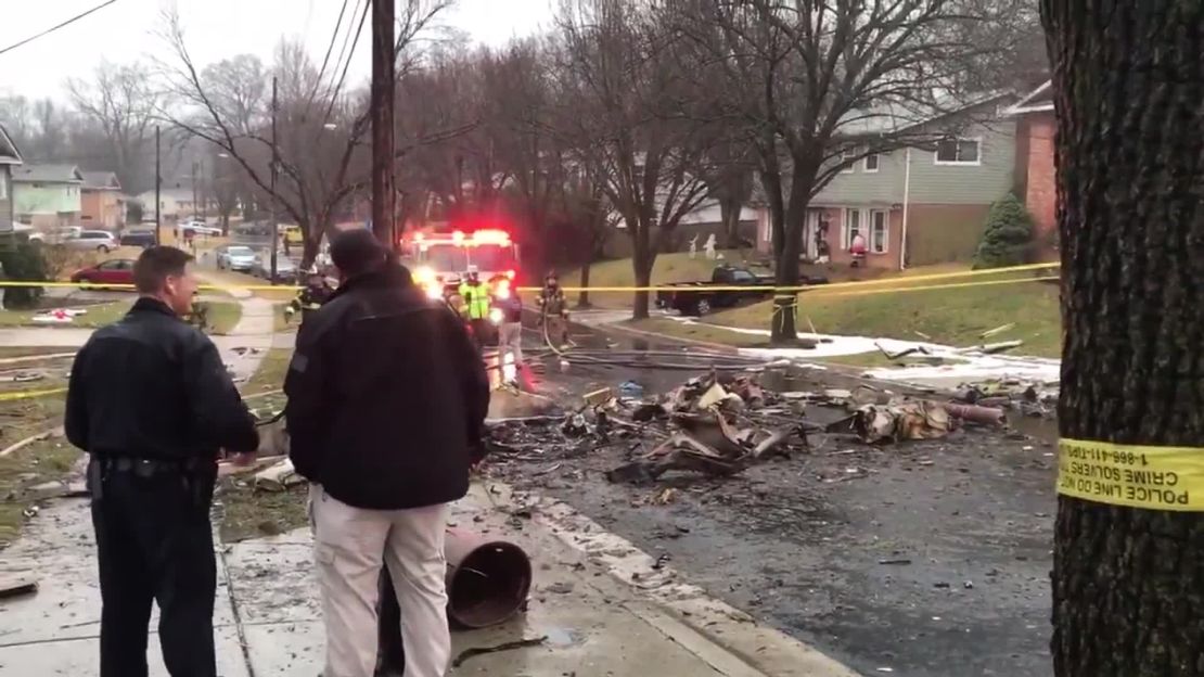 Debris littered the residential street after a plane crashed in Lanham, Maryland, on Sunday, December 29, 2019.