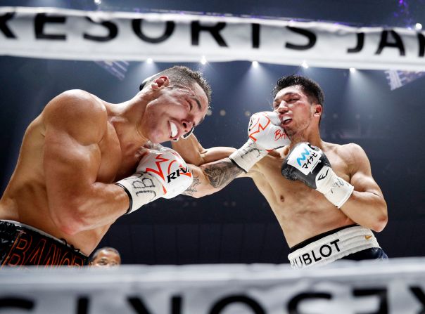 Japanese middleweight Ryota Murata and Canada's Steven Butler fight during the fifth round of their world boxing title match at Yokohama Arena in Yokohama, Japan, on Monday, December 23. Murata defeated Butler to retain his World Boxing Association title.