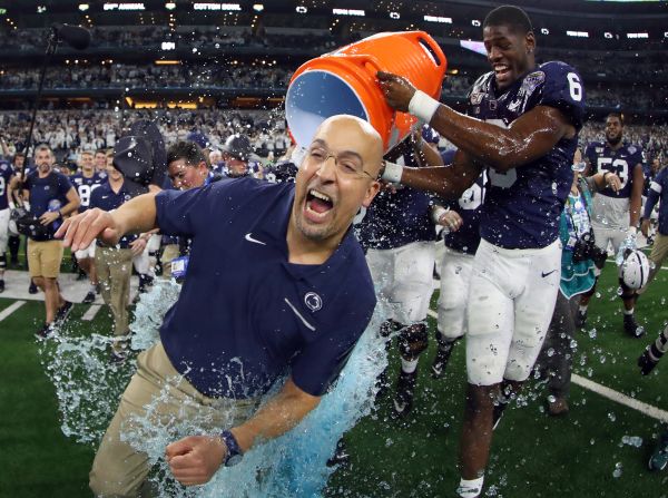 Penn State head coach James Franklin gets soaked with Gatorade by Cam Brown after the Nittany Lions beat the Memphis Tigers 53-39 at the AT&T Stadium in Arlington, Texas, on Saturday, December 28.