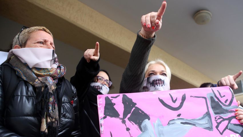 Protesters stage a demonstration outside a court house in Paralimni, Cyprus on Monday, December 30, 2019, in support of a 19 year-old British woman who was found guilty of fabricating claims that she was gang raped by 12 Israelis. Announcing his verdict, Judge Michalis Papathanasiou said the defendant didn't tell the truth and tried to deceive the court with "convenient"and "evasive" statements in court. She is due to be sentenced on Jan. 7.(AP Photo/Philippos Christou)