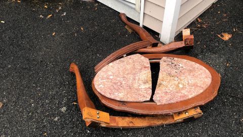 Josef Gluck said he used this table to hit the knife-wielding man in the face.
