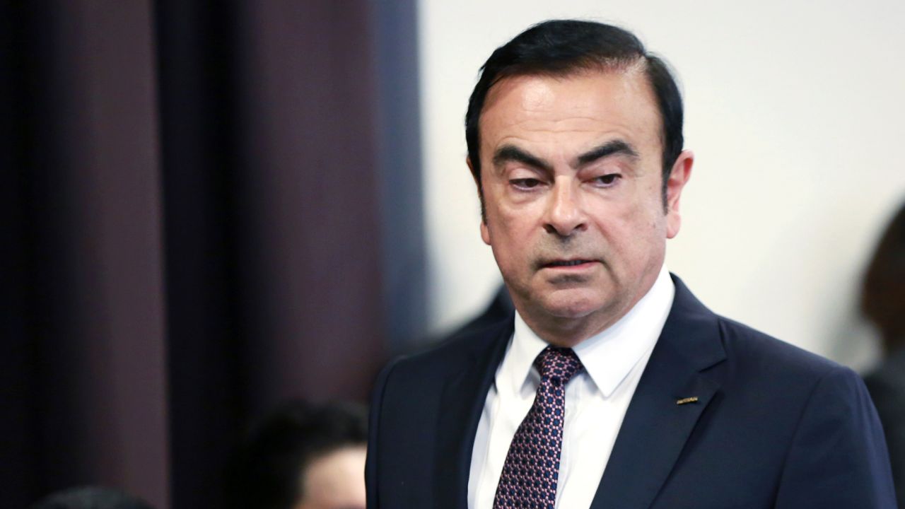 FILE - In this May 12, 2016, file photo, then Nissan Motor Co. President and CEO Carlos Ghosn arrives for a joint press conference with Mitsubishi Motors Corp. in Yokohama, near Tokyo. At left is Nissan Chief Executive Hiroto Saikawa. Japan's court has denied the prosecutor's request to extend detention of ex-Nissan chair Carlos Ghosn. (AP Photo/Eugene Hoshiko, File)