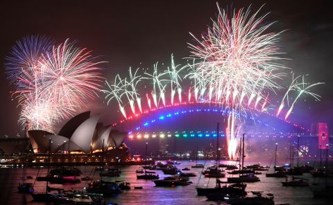 New Year's Eve fireworks erupt over Sydney's iconic Harbour Bridge and Opera House.