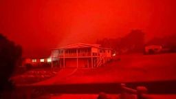 Jason Selmes has evacuated his house in Mallacoota, Victoria, Australia, to the beachfront of the town. He told CNN it is 10am local time on Tuesday and it's pitch black in the area. He also said there are six people with him.