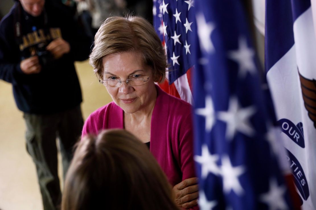 Democratic presidential candidate Sen. Elizabeth Warren, D-Mass., speaks with an audience member during a town hall meeting, Monday, Dec. 16, 2019, in Keokuk, Iowa. 