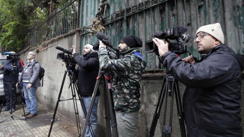 Members of the press wait outside a property beloging to Carlos Ghosn in Beirut.