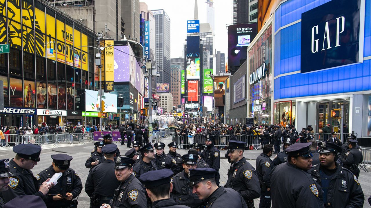 NYPD officers get instructions as people arrive in the morning to celebrate New Years eve in Times Square on December 31, 2019 in New York City.