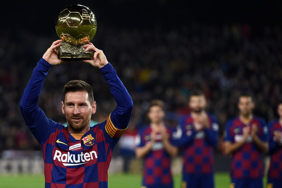 Lionel Messi poses with his sixth Ballon d'Or before a La Liga game for Barcelona earlier this month. 