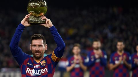 Lionel Messi poses with his sixth Ballon d'Or before a La Liga game for Barcelona earlier this month. 