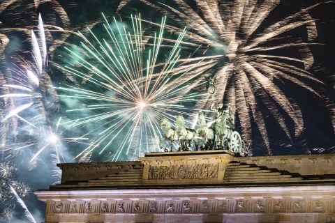 Fireworks light the sky above the Brandenburg Gate in Berlin.