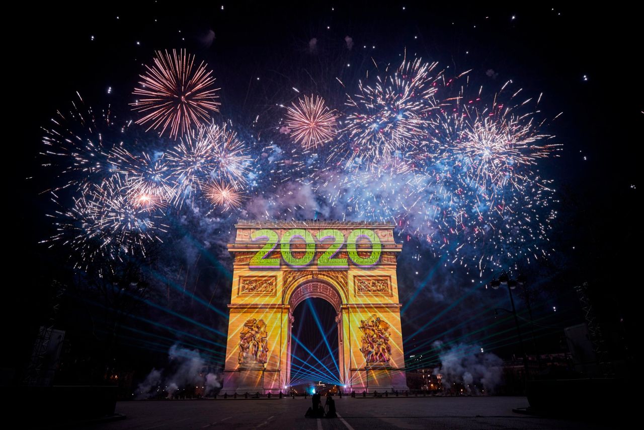 The Arc de Triomphe is engulfed in fireworks as thousands descended on the Champs Elysees to welcome the new year in Paris.
