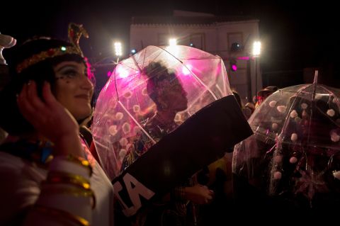 People in costumes gather to welcome the new year in Coin, Spain.