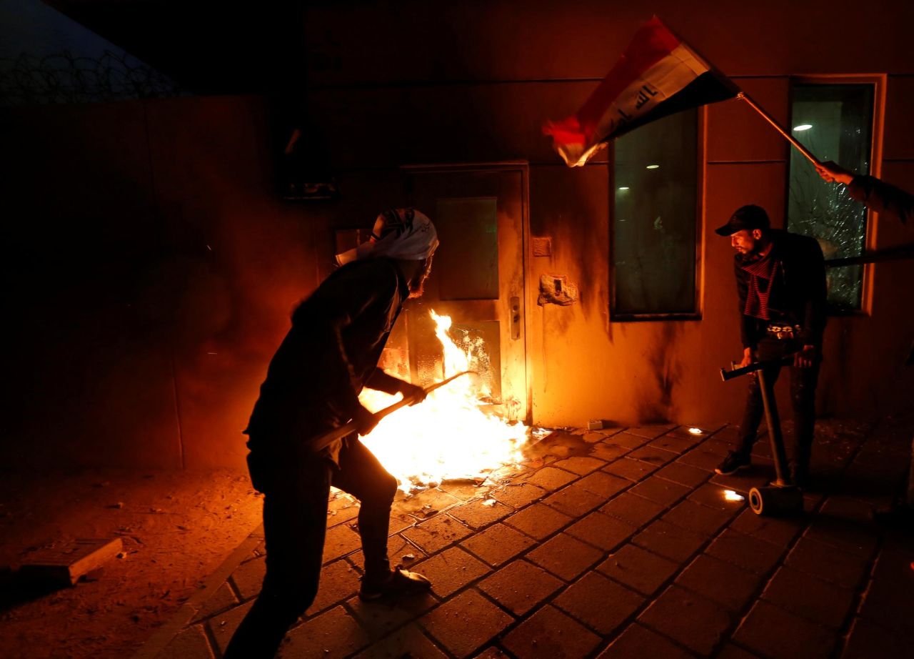Protesters set fire to a reception room of the US Embassy in Baghdad, Iraq, on Tuesday, December 31. The embassy was attacked during demonstrations in response to recent airstrikes in Iraq and Syria conducted by US forces.