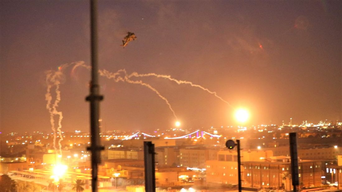 A US Army Apache helicopter drops flares over Baghdad in a show of force.