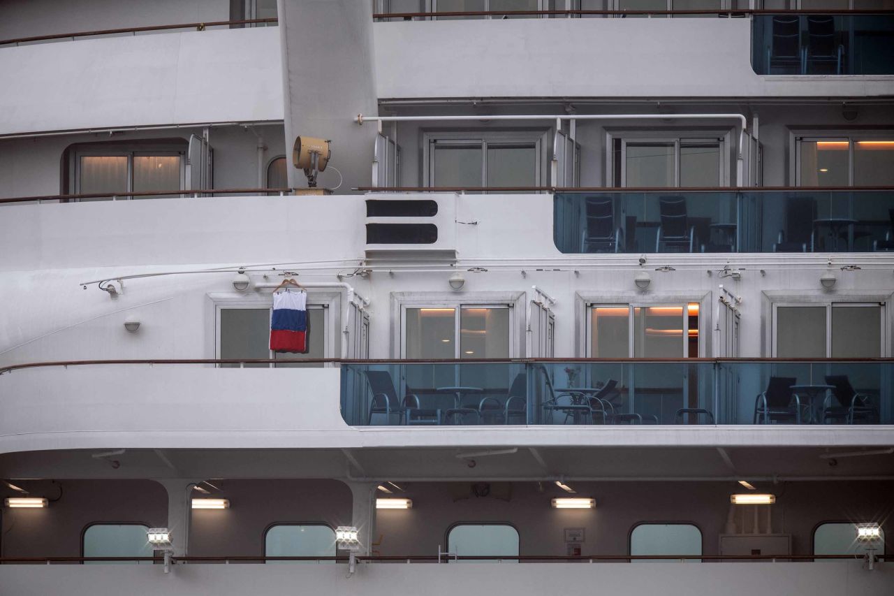 A Russian flag is hung from a balcony onboard the quarantined Diamond Princess cruise ship in Yokohama, Japan on Sunday. 