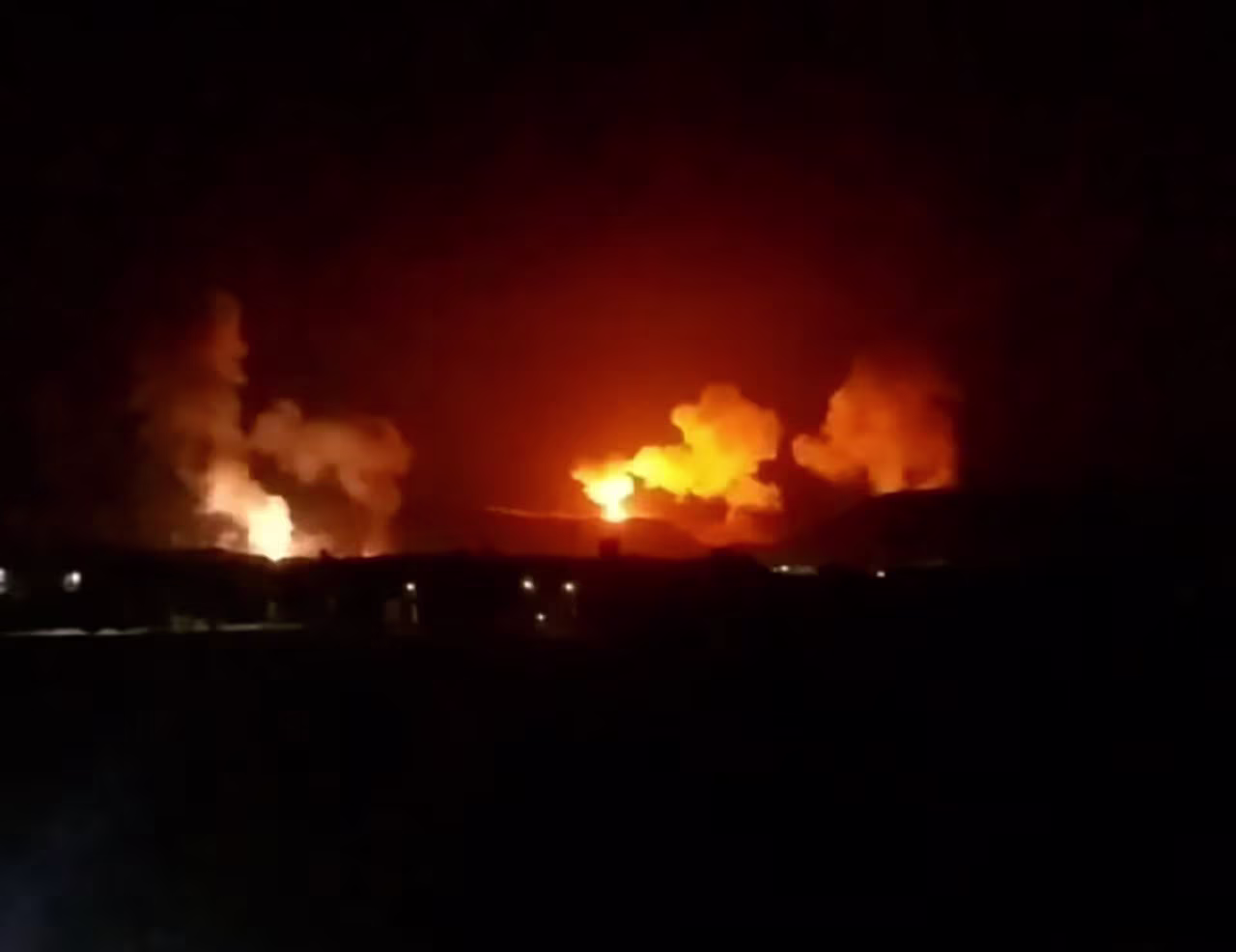 A still from a video shows multiple explosions in Saada province, north of Sanaa, Yemen, on January 12, local time.