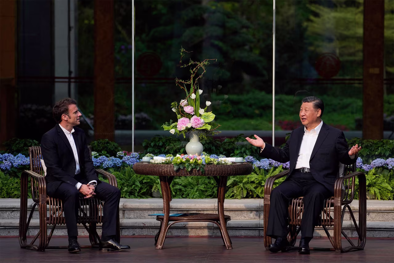 Chinese Leader Xi Jinping, right, and French President Emmanuel Macron, left, attend a tea ceremony at the Guangdong province governor's residence in Guangzhou on April 7. 
