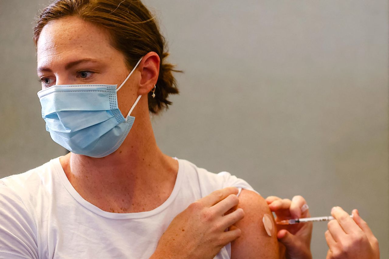 Three time Olympian Australian swimmer Cate Campbell receives her dose of the Pfizer/BioNTech vaccine at the Queensland Sports and Athletics Centre in Brisbane on May 10.