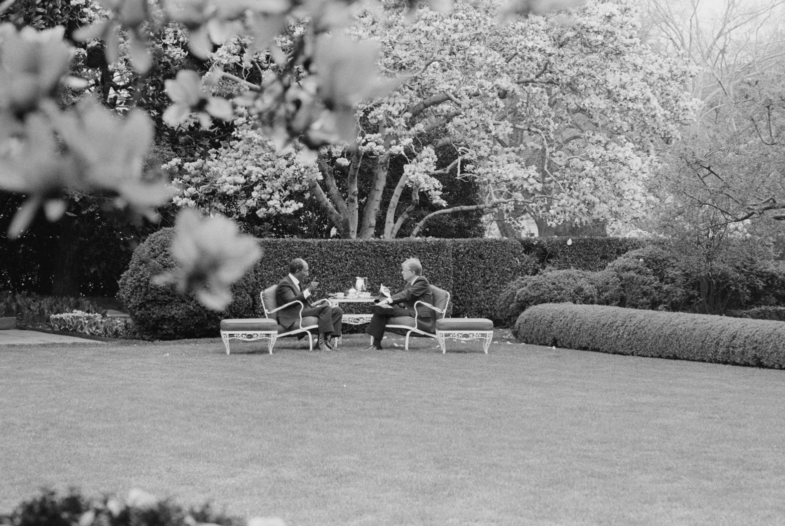 Carter and Egyptian President Anwar Sadat have refreshments in the Rose Garden of the White House in 1980. A year earlier Sadat, Carter and Israeli Prime Minister Menachem Begin signed peace accords ending 31 years of war between Egypt and Israel.