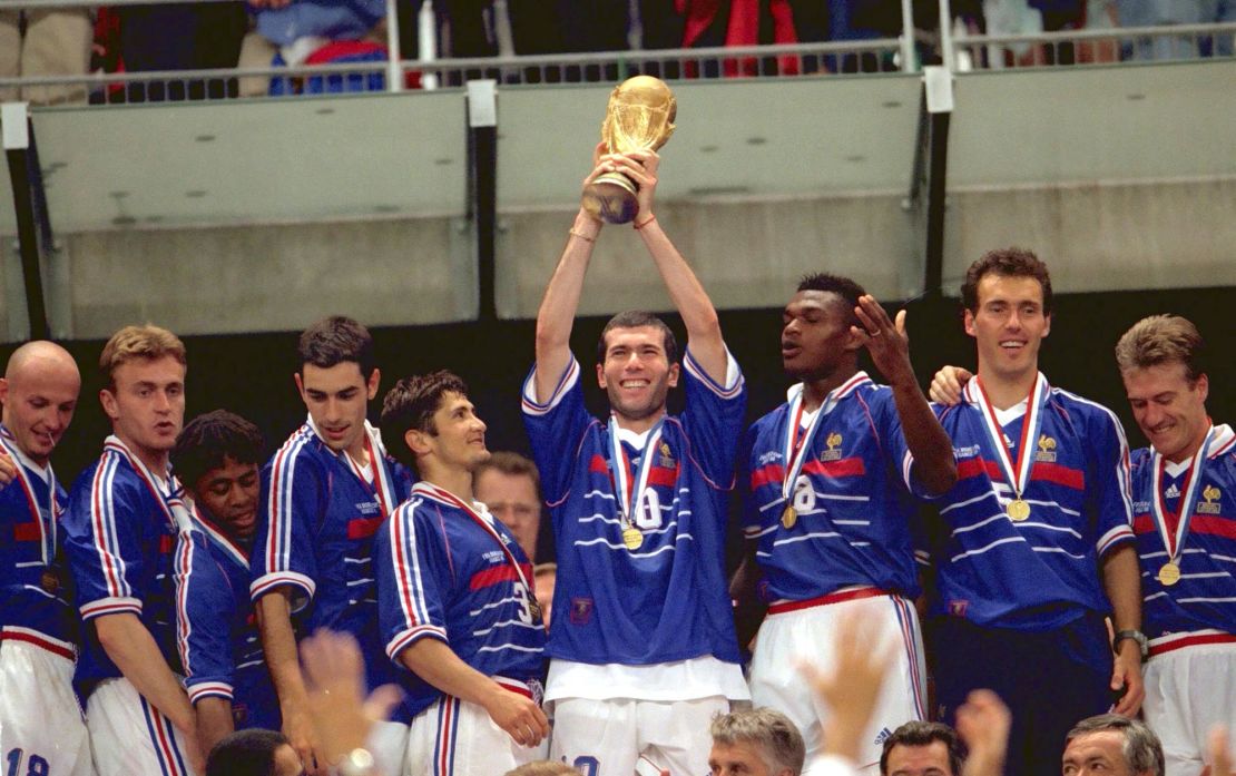Zinedine Zidane holds the trophy aloft to celebrate France's World Cup final win in 1998.