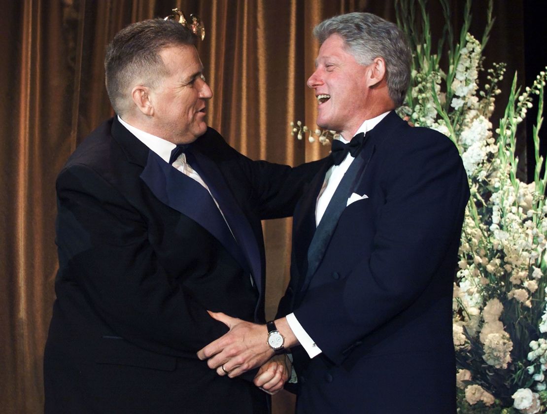 U.S. President Bill Clinton (R) shakes hands with LGBTQ activist David Mixner.