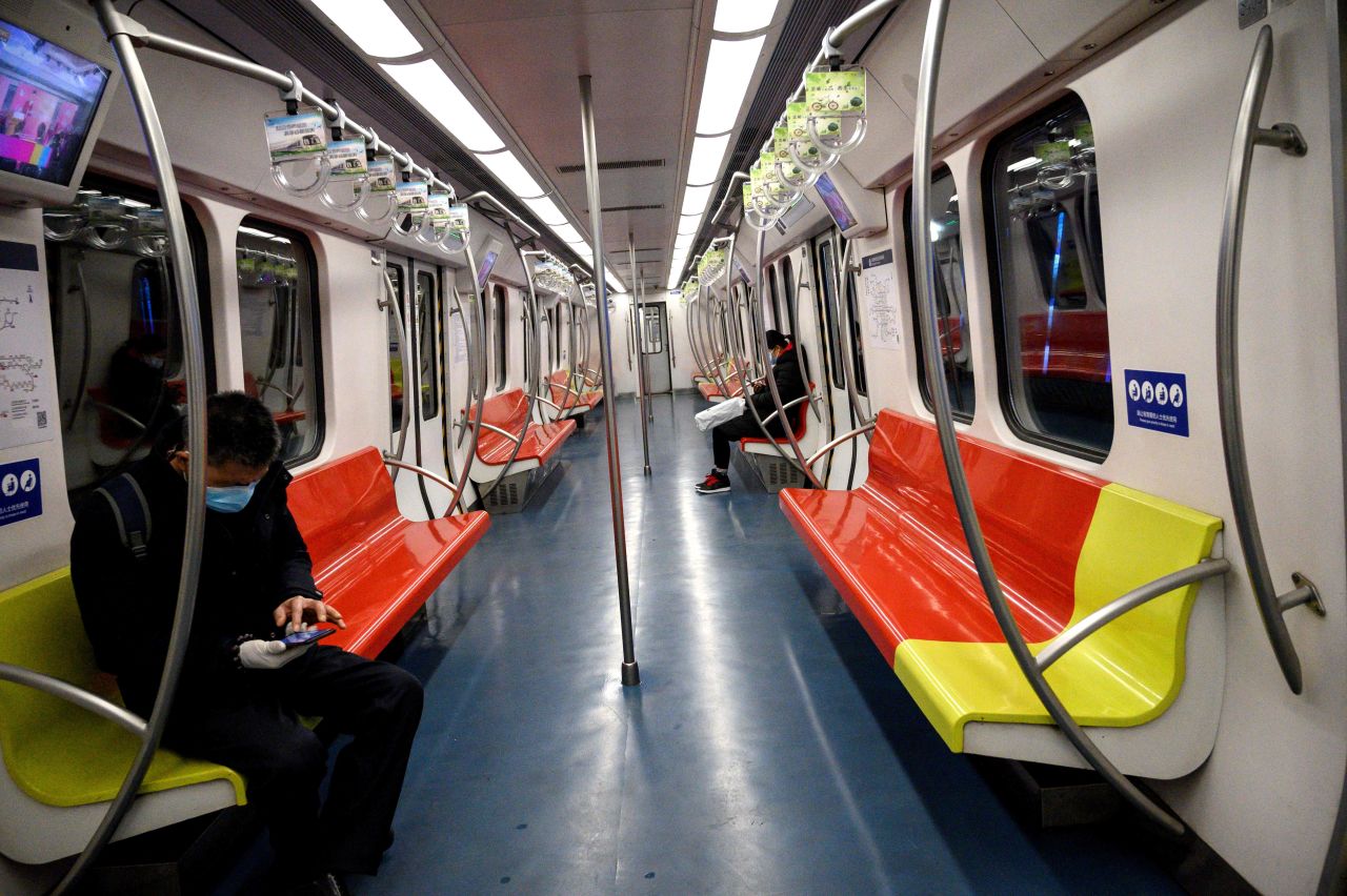 People wearing face masks inside a subway train in Beijing on January 28, 2020.