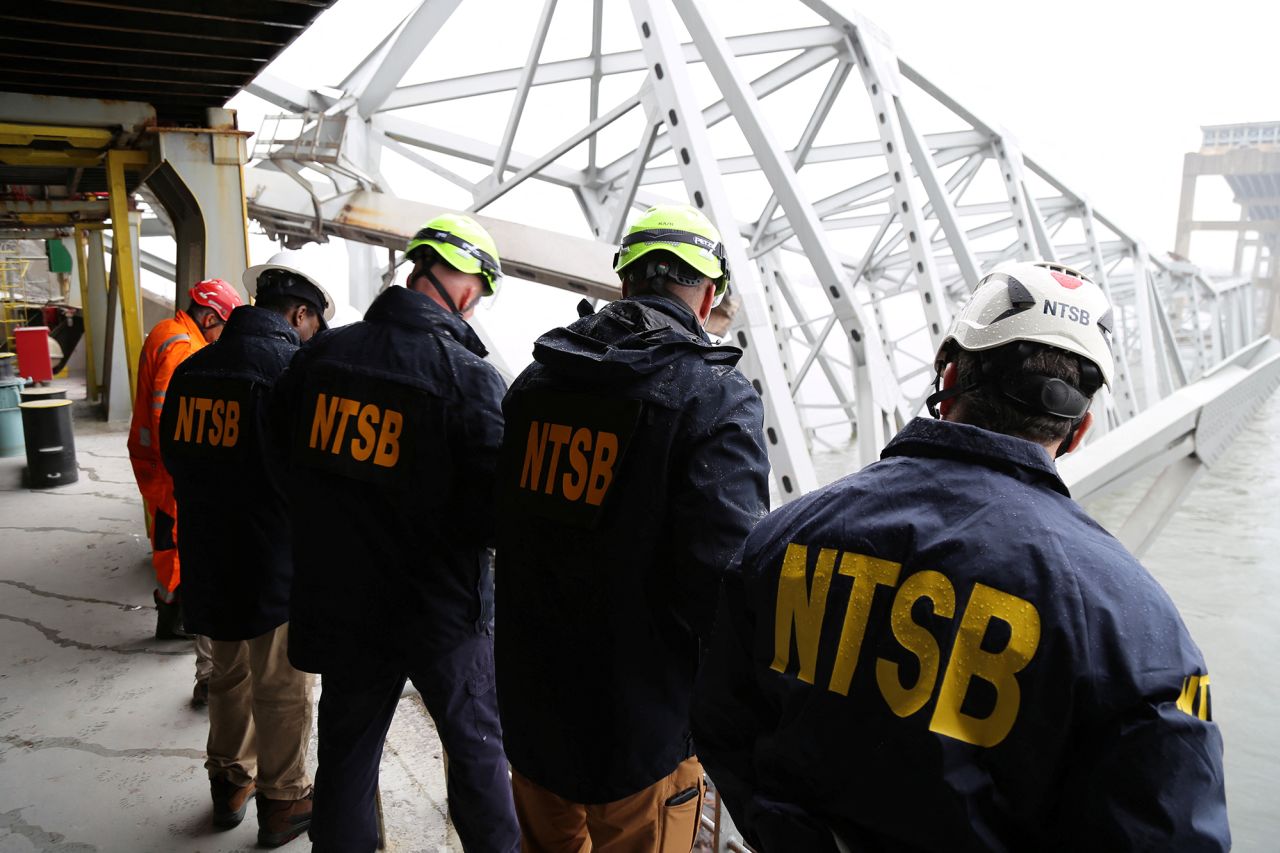 National Transportation Safety Board investigators work on the Dali cargo vessel in Baltimore, Maryland, on March 27, in this NTSB handout photo. 