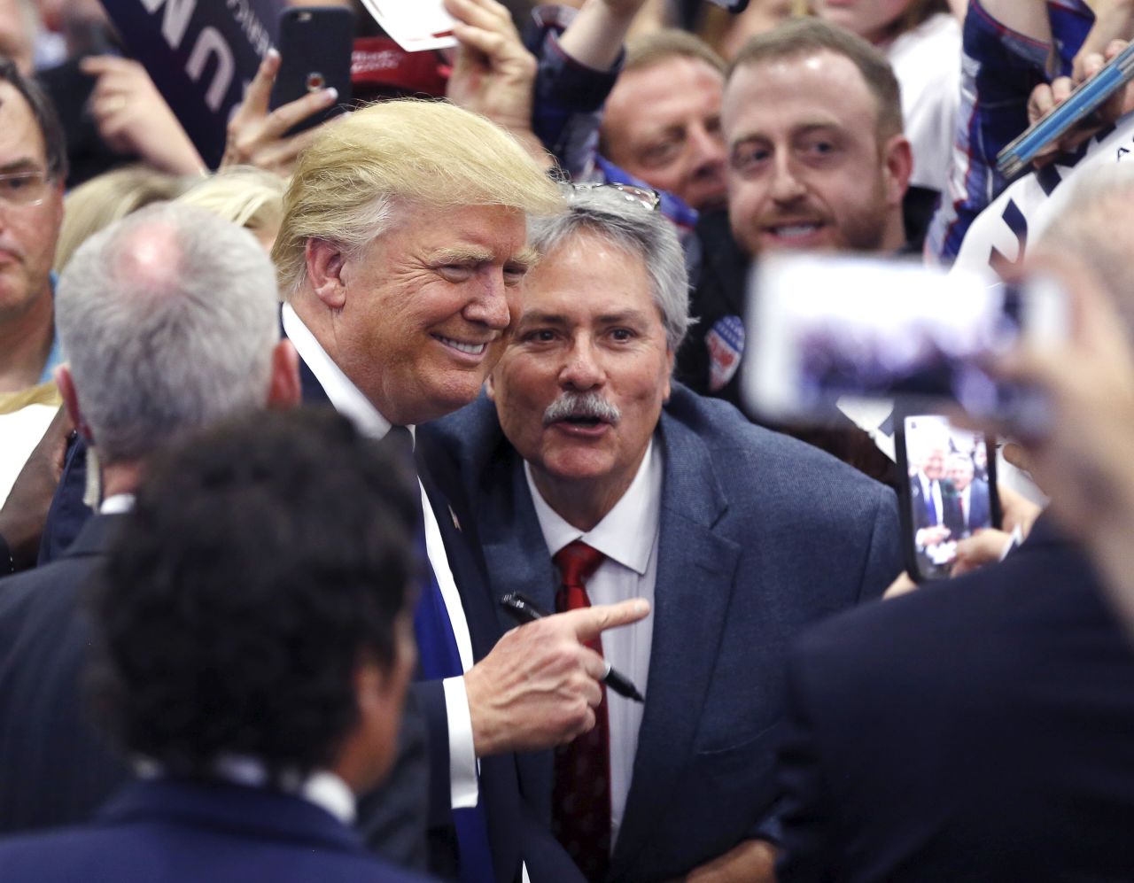 Donald Trump poses for a photo with a supporter at a Super Tuesday campaign rally in Louisville, Kentucky, on March 1, 2016.