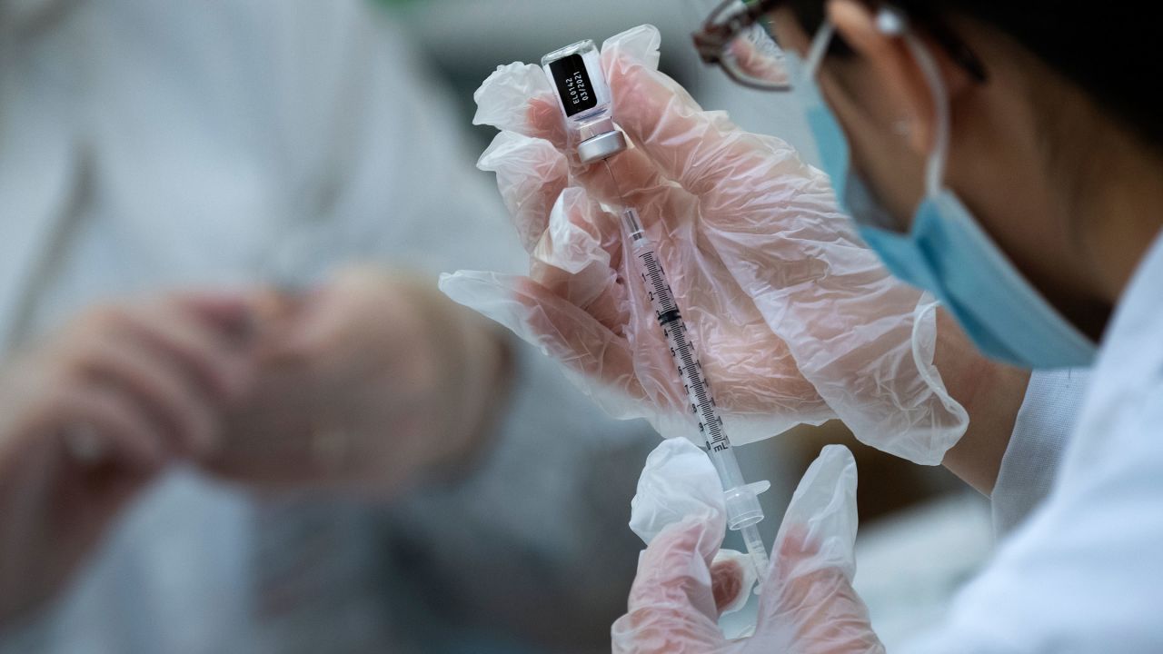 A pharmacist prepares a Covid-19 vaccine at a senior-living community in Falls Church, Virginia, on Wednesday. 