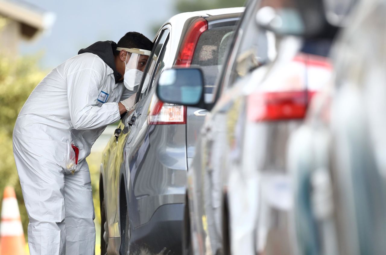 A medical professional administers a coronavirus test at a drive thru testing location in Bolinas, California, on April 20.