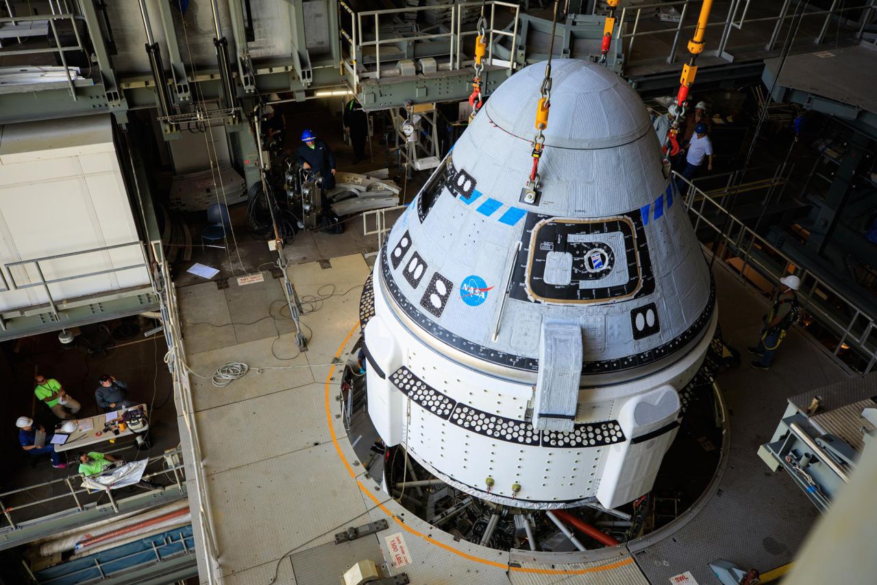 The Boeing CST-100 Starliner spacecraft is lifted at Cape Canaveral Space Force Station in Florida ahead of a May 2022 test flight.