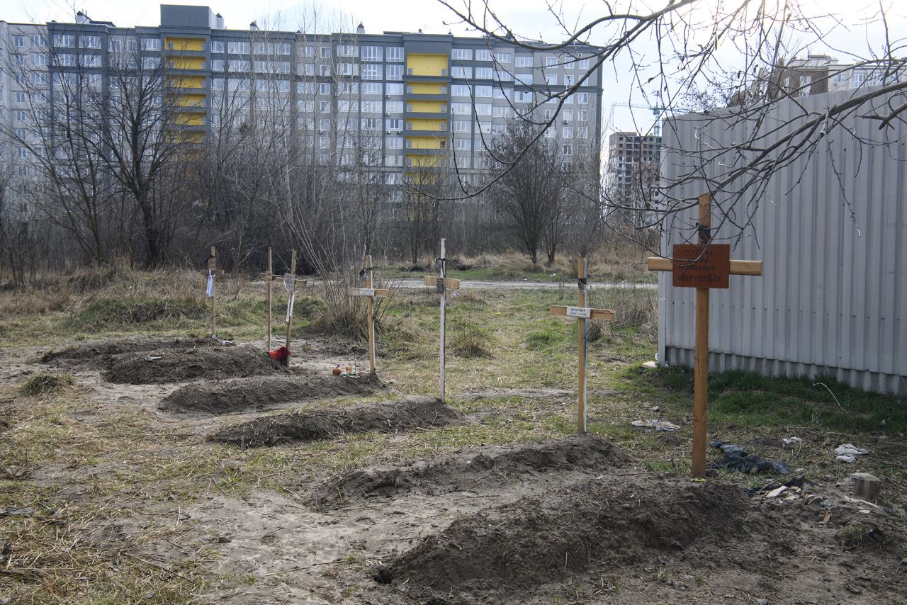 Graves with bodies of civilians next to apartments blocks in Bucha, Ukraine, on April 4.