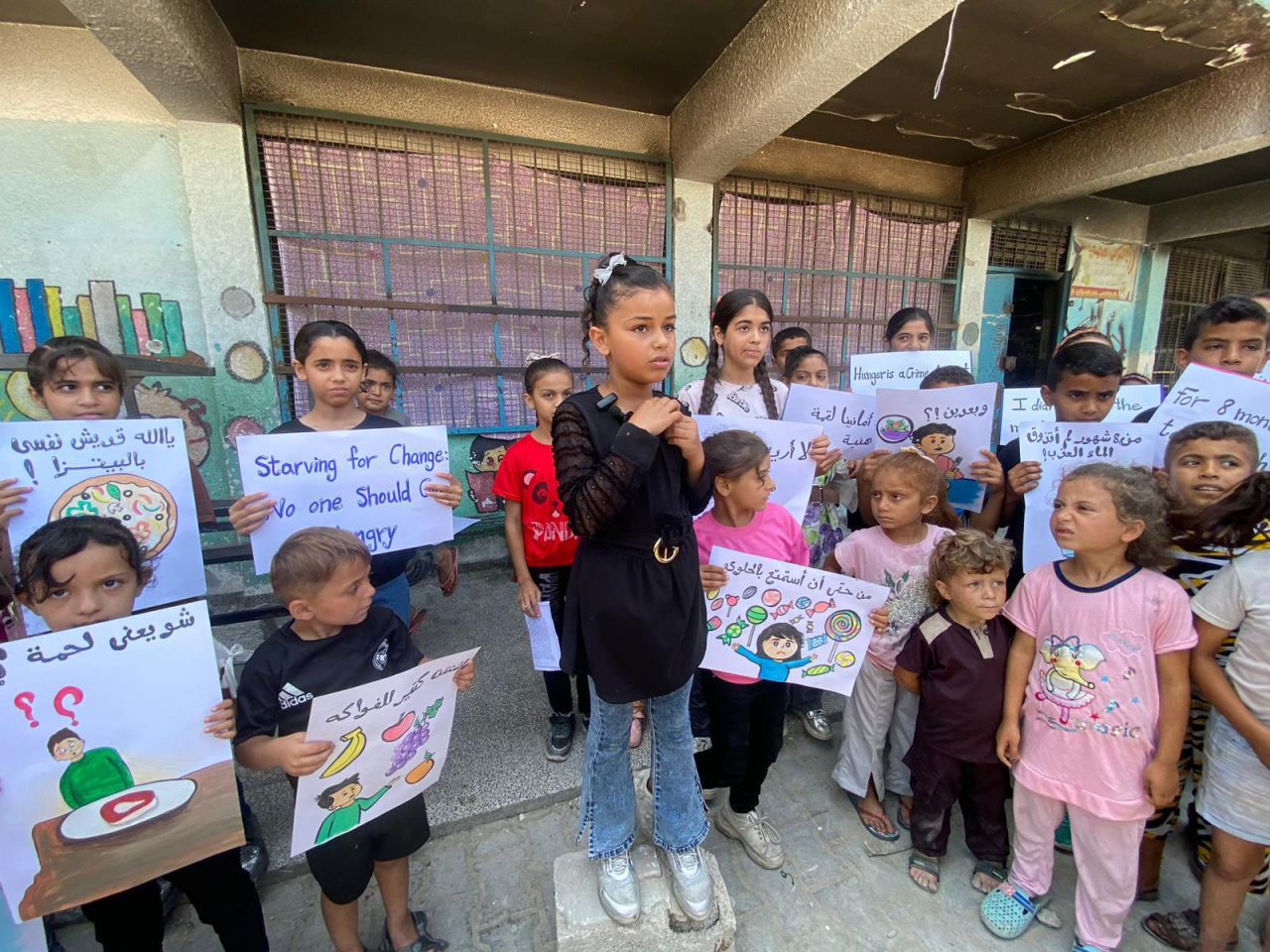 Palestinian children gather near a refugee camp in northern Gaza, on June 4, to protest Israel’s restrictions on aid entering the strip. 