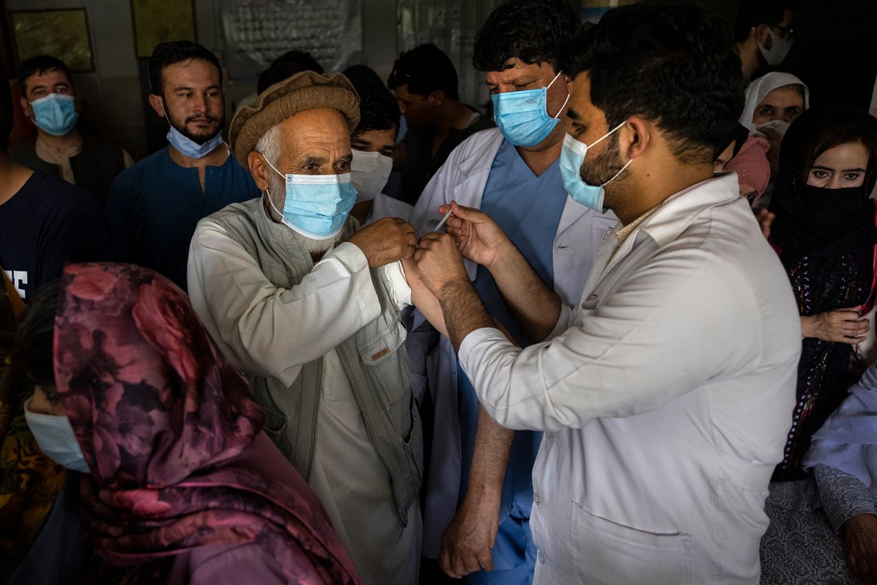 Doctor Roheed Mureed vaccinates Afghans with the J&J vaccine at the Wazir Akbar Khan hospital on July 14 in Kabul.?