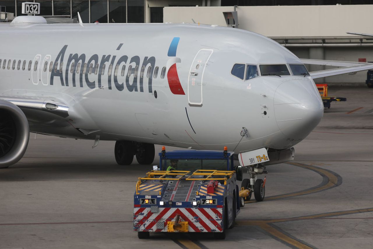 An American Airlines Boeing 737 Max 8 is towed to its gate at the Miami International Airport?on Wednesday.