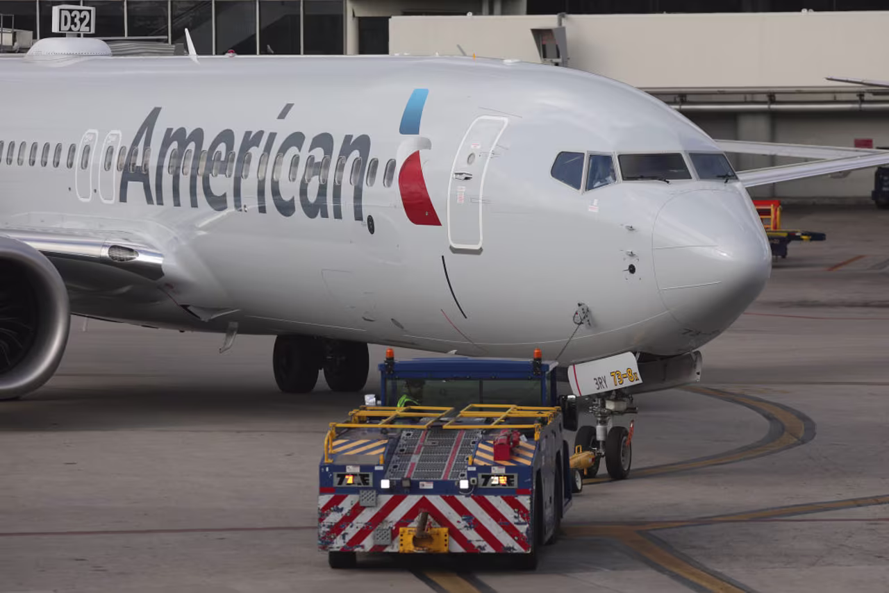 An American Airlines Boeing 737 Max 8 is towed to its gate at the Miami International Airport on Wednesday.