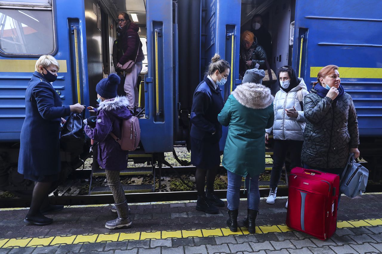 Passengers arrive on a train from Odessa via Lviv in Ukraine to the railway station in Przemysl, Poland, on February 24.