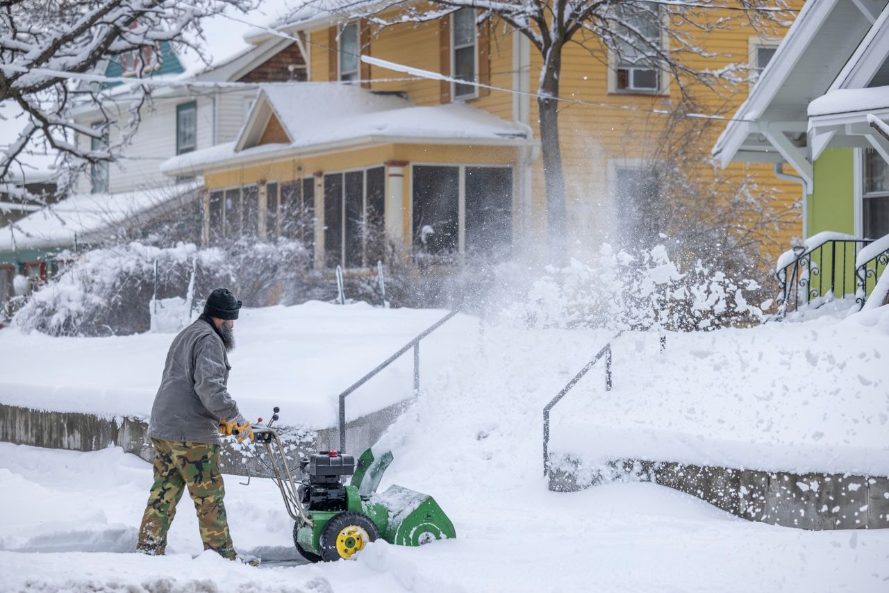 Residents plow snow during a storm in Des Moines, Iowa, on Tuesday, January 9.