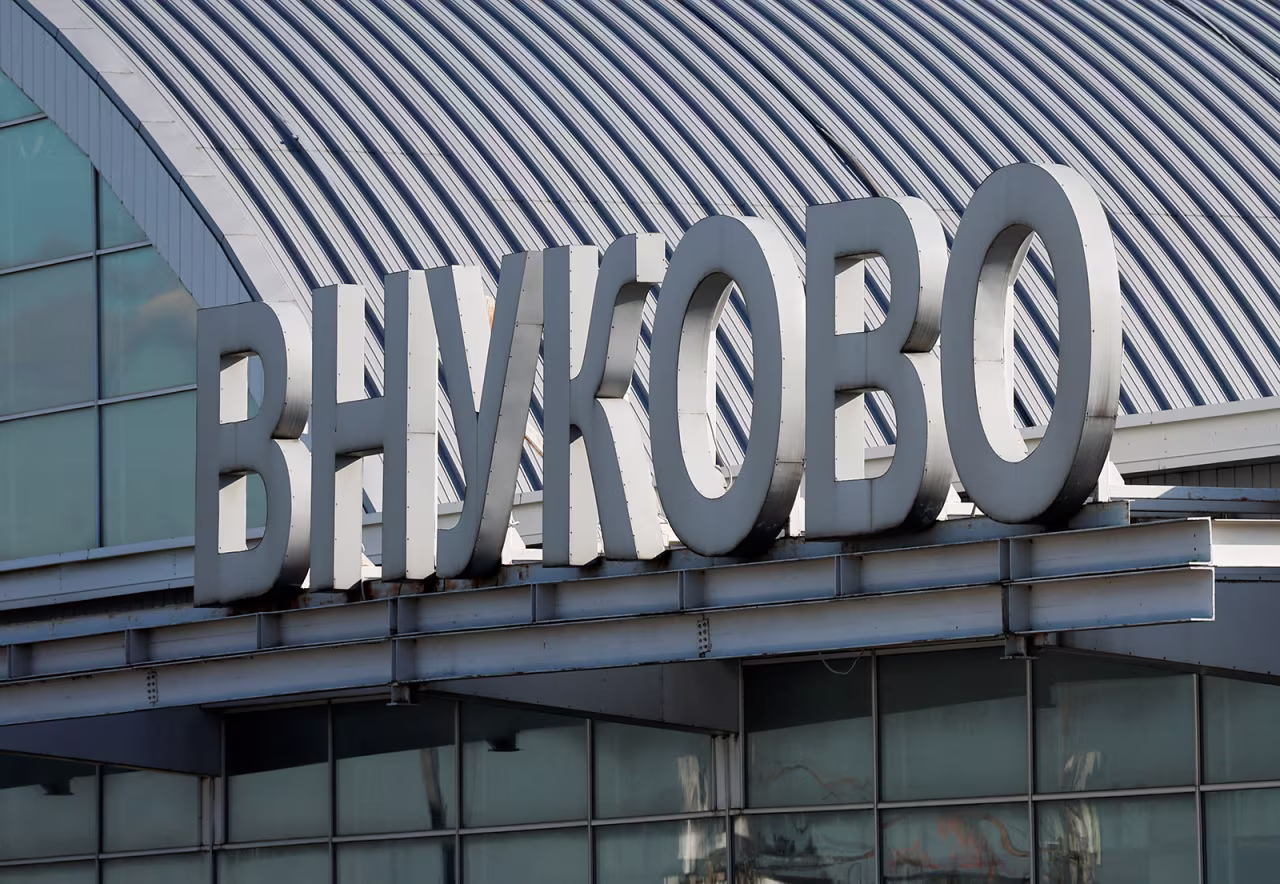 A sign with the name of Vnukovo International Airport is seen on the rooftop of its terminal in Moscow, Russia on August 21.