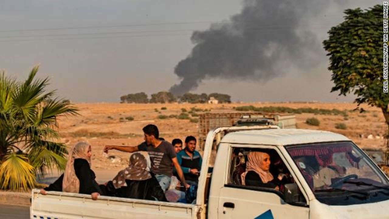 Civilians flee in a truck amid Turkish bombardment on Syria's northeastern town of Ras al-Ain, along the Turkish border.