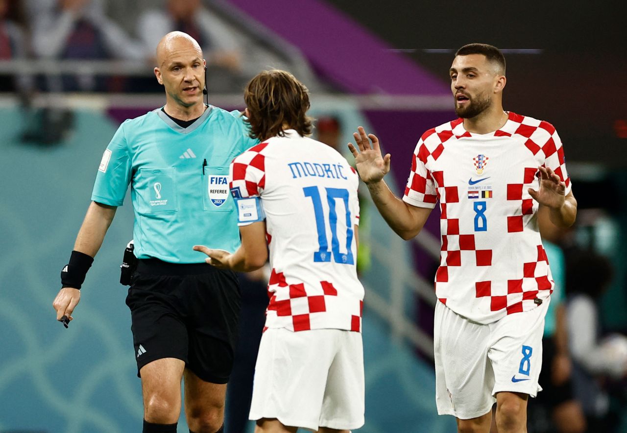 Croatia's Luka Modric and Mateo Kovacic appeal to referee Anthony Taylor after the VAR decision.