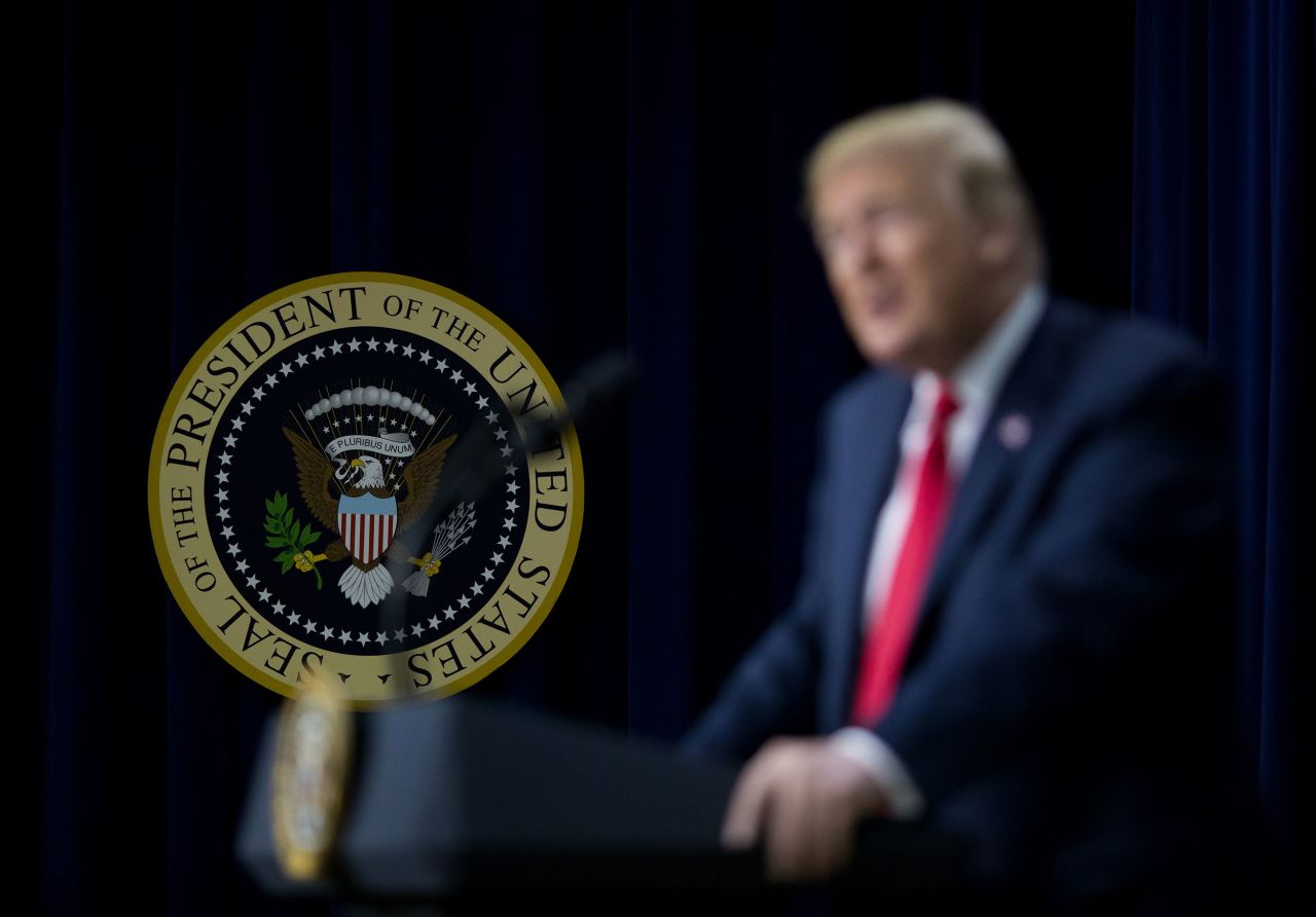 The presidential seal is displayed behind then-President Donald Trump during an event at the Eisenhower Executive Office Building in Washington, DC, in 2018.