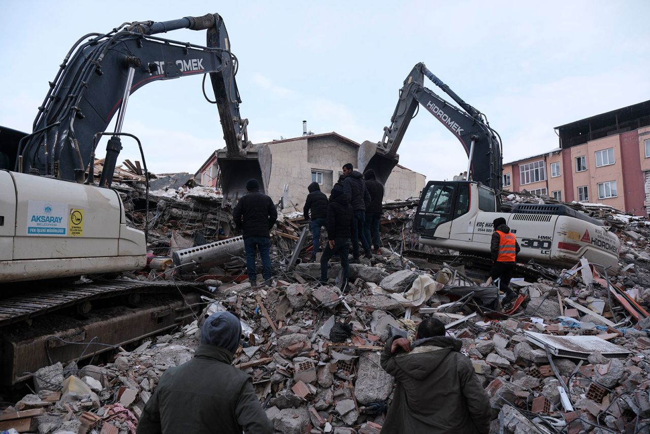 Civilians and rescue volunteers search through debris to find victims on February 8 in Elbistan, Turkey. 