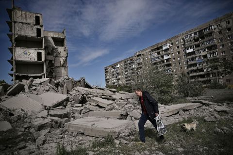 A man walks past a damaged building after a strike in Kramatorsk on May 25. 