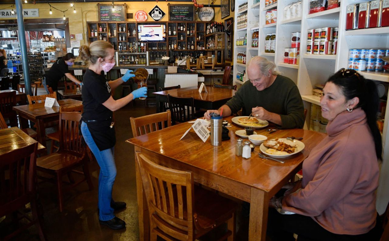 Lee and Johnny Laing enjoy having a meal inside Puckett’s on Monday, April 27, in Williamson County, Tennesee. Puckett’s opened on Monday at 50% capacity.