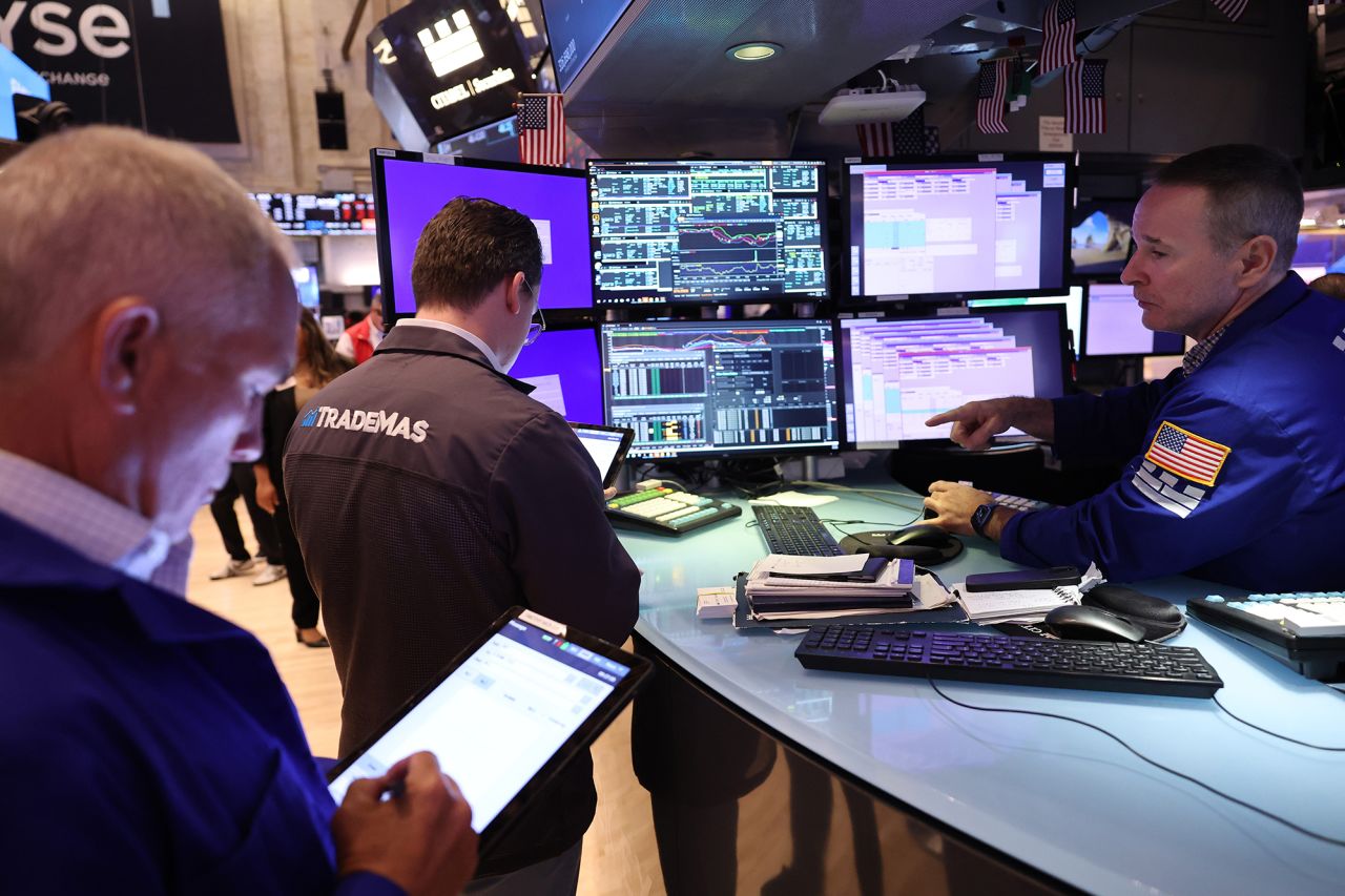 Traders work on the floor of the New York Stock Exchange during morning trading on September 4.