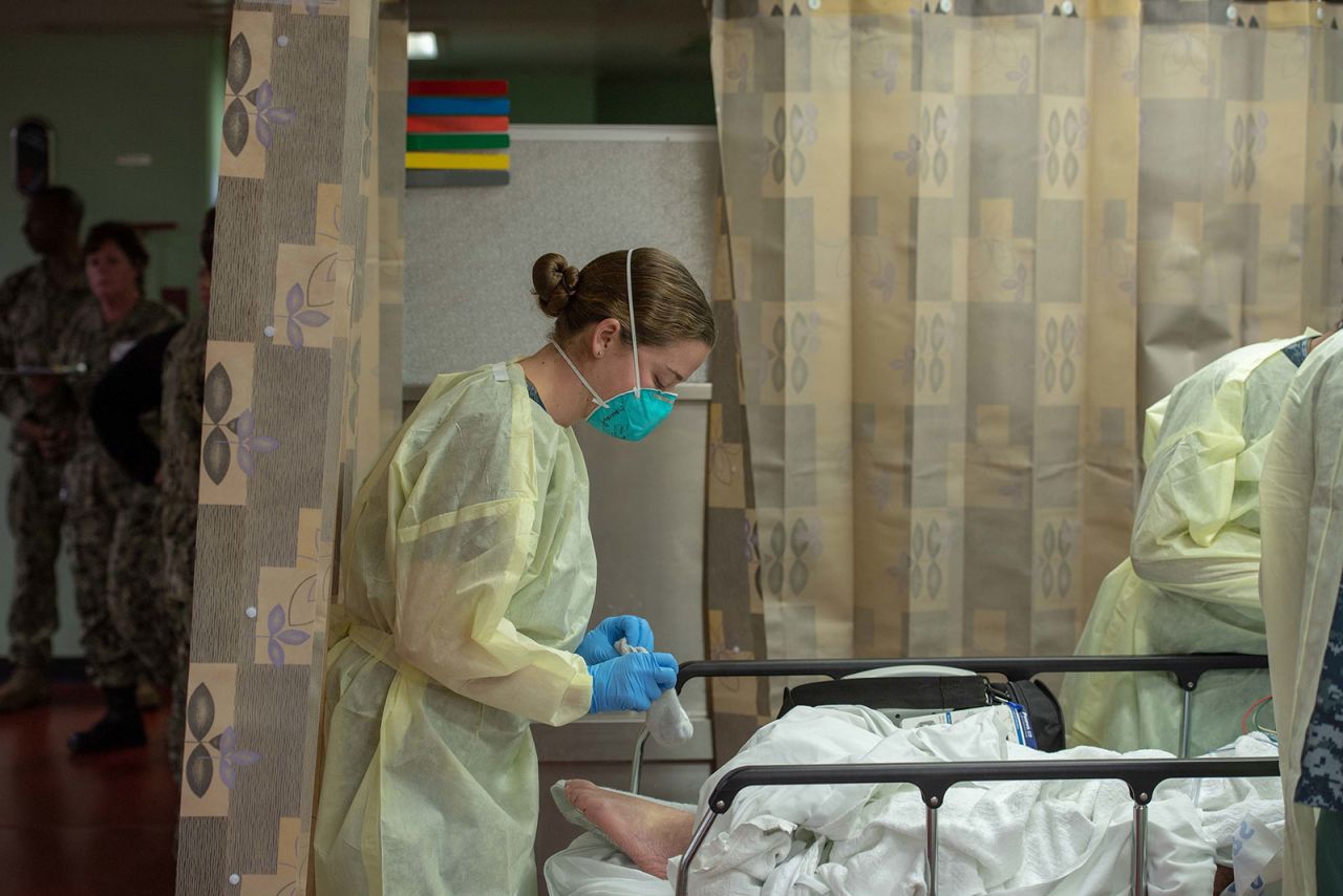 Sailors treat a patient on the USNS Mercy in Los Angeles, California, on March 29.