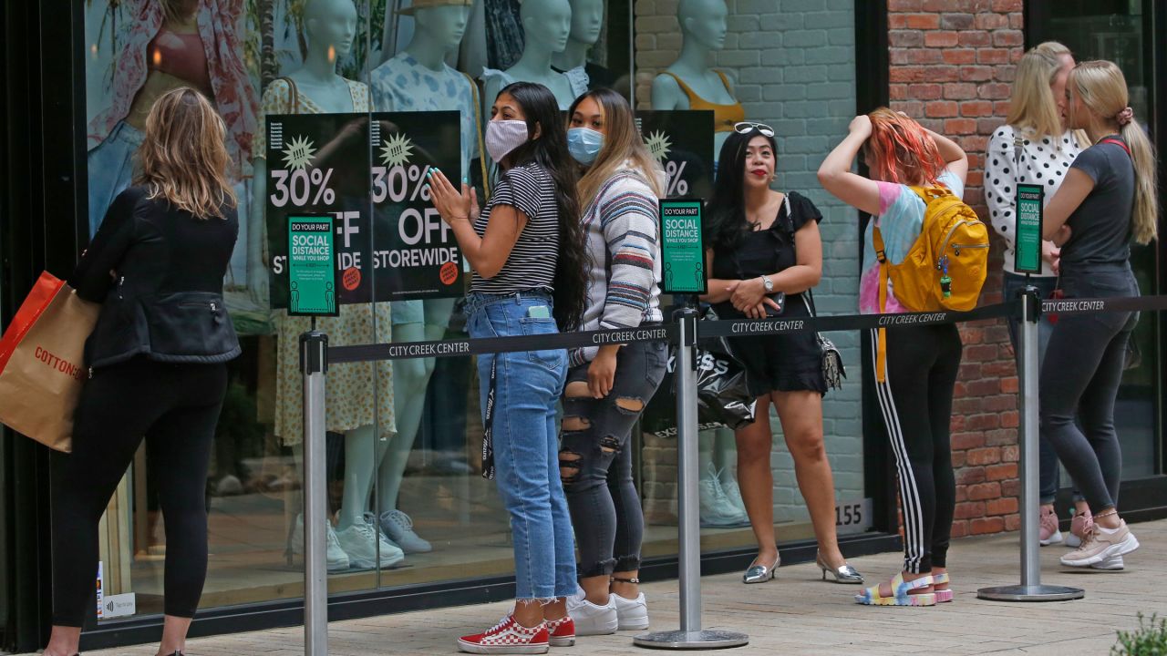 People wait in line in front of a store in Salt Lake City on May 22.