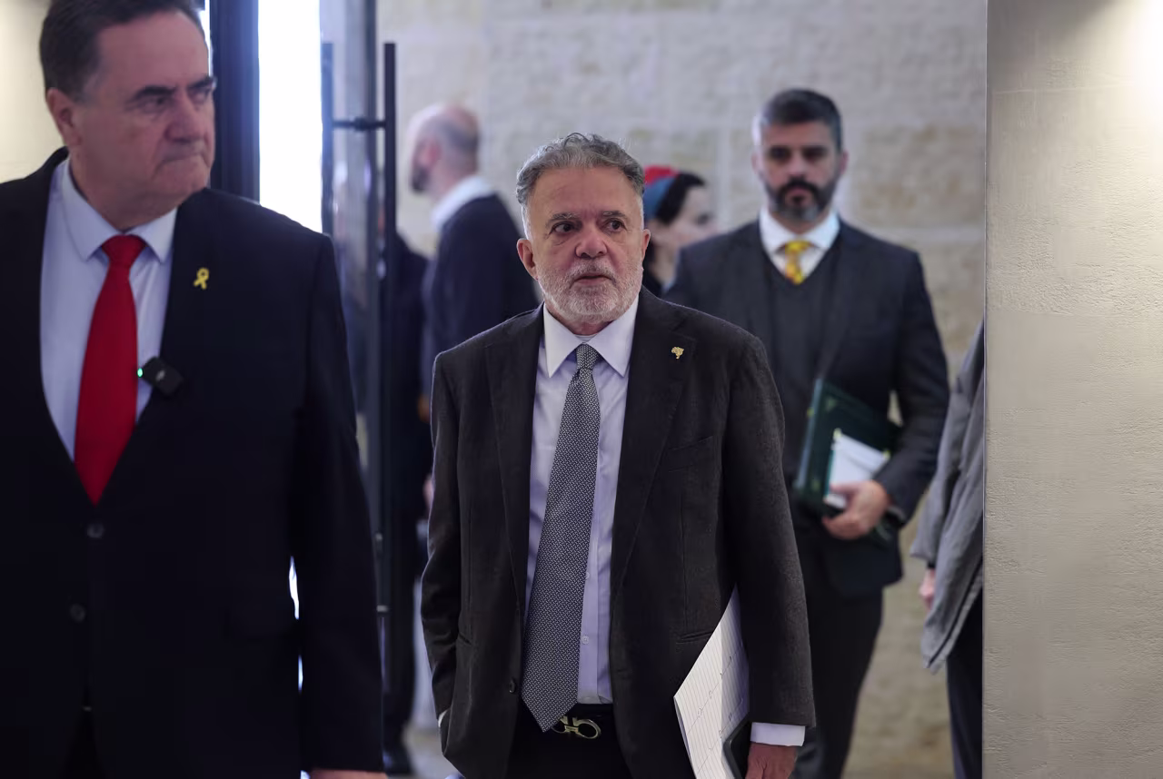Brazilian ambassador to Israel Frederico Meyer, center, and Israeli Foreign Minister Israel Katz arrive at the Yad Vashem Holocaust Memorial Museum in Jerusalem, in February.