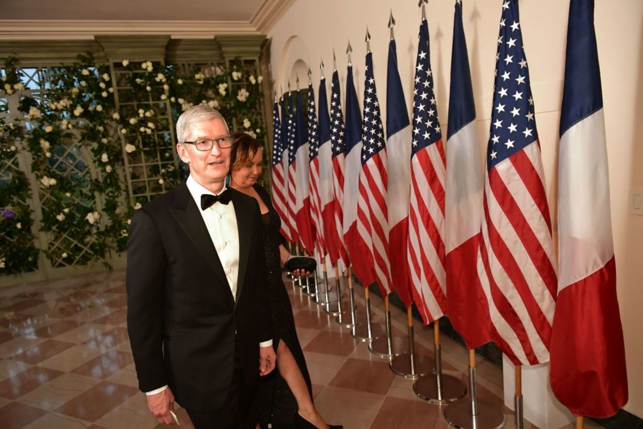 Apple CEO Tim Cook arrives with Lisa Jackson.